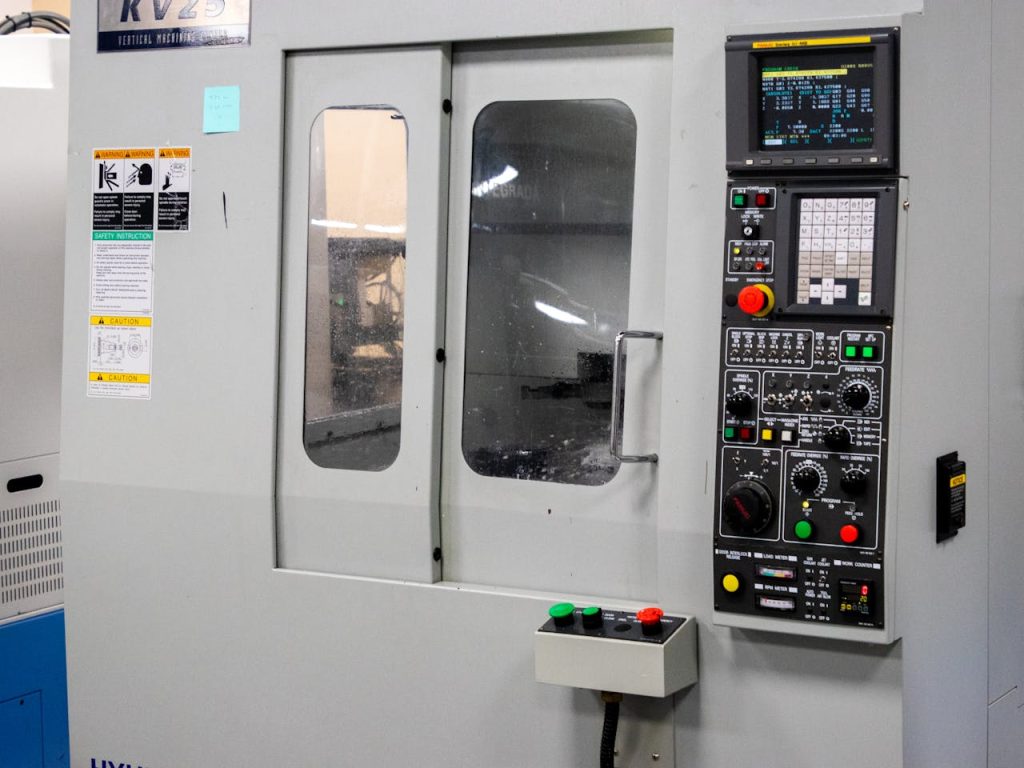 A modern CNC machine control panel used for precise industrial processes indoors.